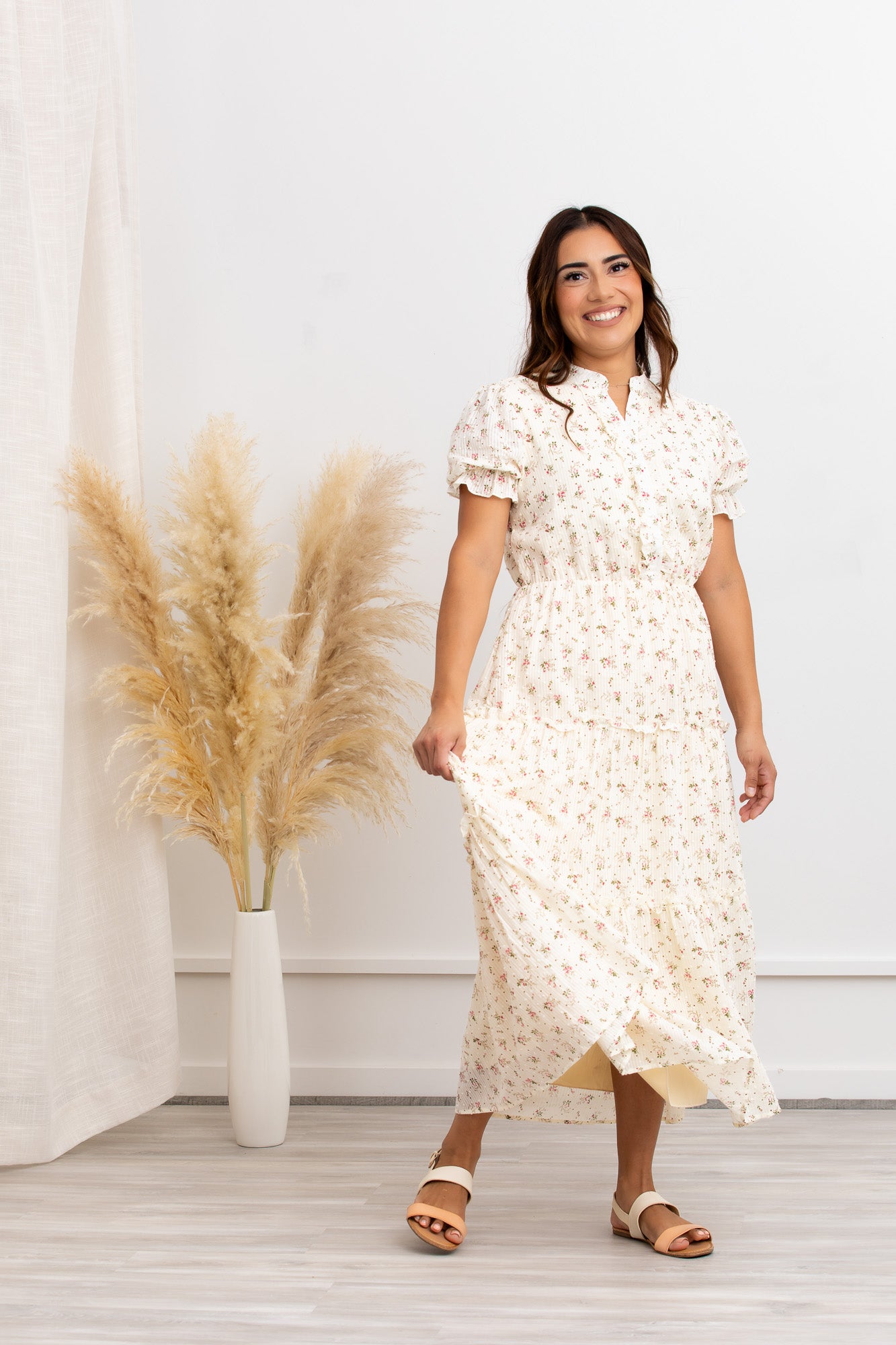 Model wearing a Floral Cotton Dress, Liana Tiered Maxi by Peony Alley, featuring a tiered maxi skirt and floral print.