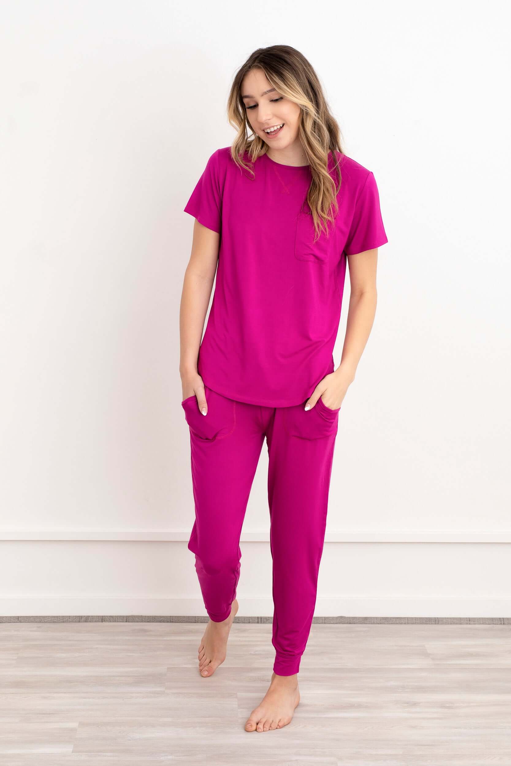 In this photo, a girl exudes casual elegance in our Rosy Pink Modal Short Sleeve and Pants Pajama Set. The soft, breathable fabric drapes gracefully, offering both comfort and style. The cool rosy hue adds a touch of sophistication to her relaxed ensemble