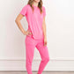 Chic and comfy, our Pink Rose Bamboo Pajama Set is showcased by a graceful girl. The soft, sustainable fabric and rosy hue create a perfect blend of style and coziness, inviting you to embrace serene moments in eco-friendly fashion."