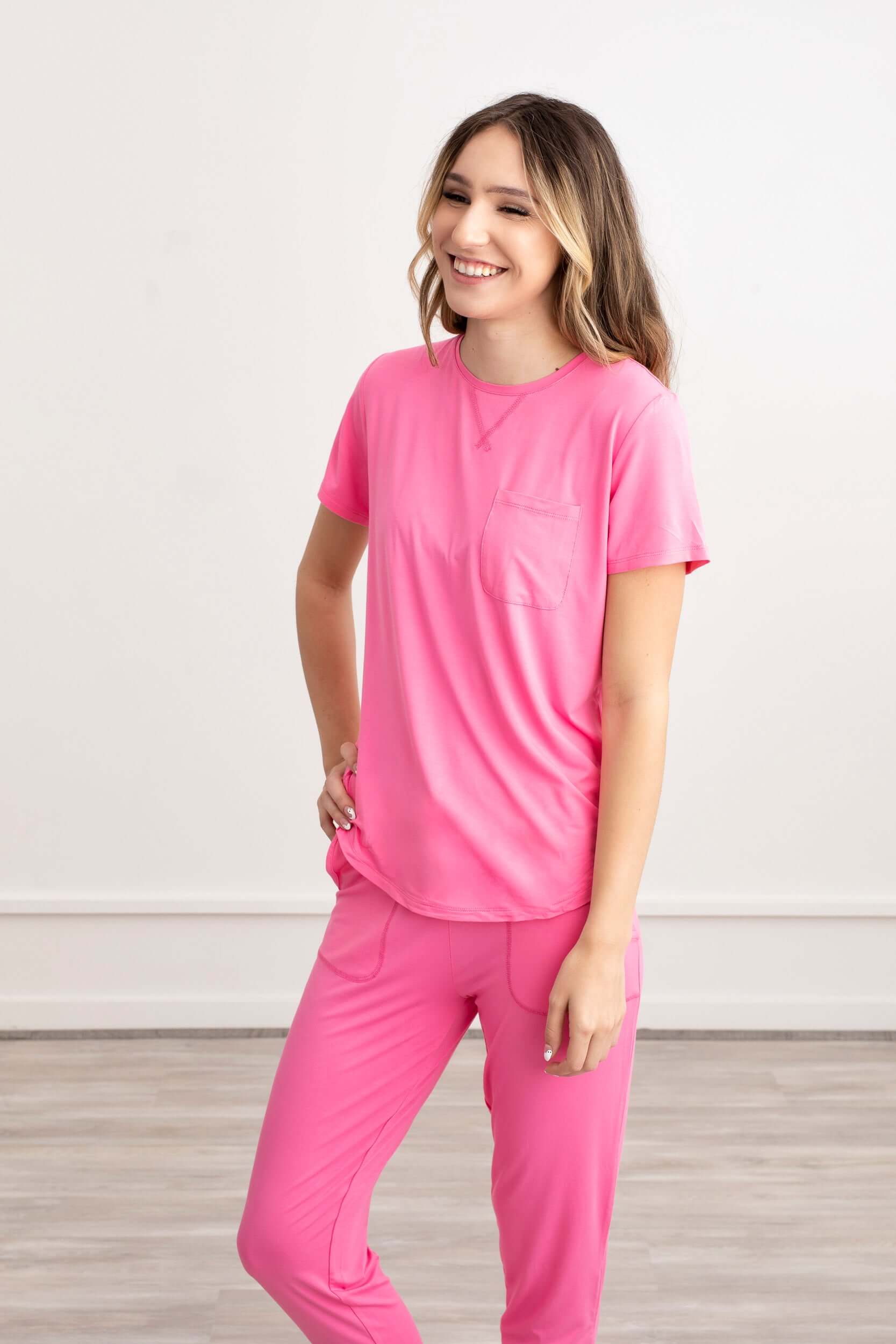 Chic and comfy, our Pink Rose Bamboo Pajama Set is showcased by a graceful girl. The soft, sustainable fabric and rosy hue create a perfect blend of style and coziness, inviting you to embrace serene moments in eco-friendly fashion."