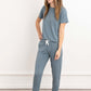 In this photo, a girl exudes casual elegance in our Blue-Gray Modal Short Sleeve and Pants Pajama Set. The soft, breathable fabric drapes gracefully, offering both comfort and style. The cool blue-gray hue adds a touch of sophistication to her relaxed ens