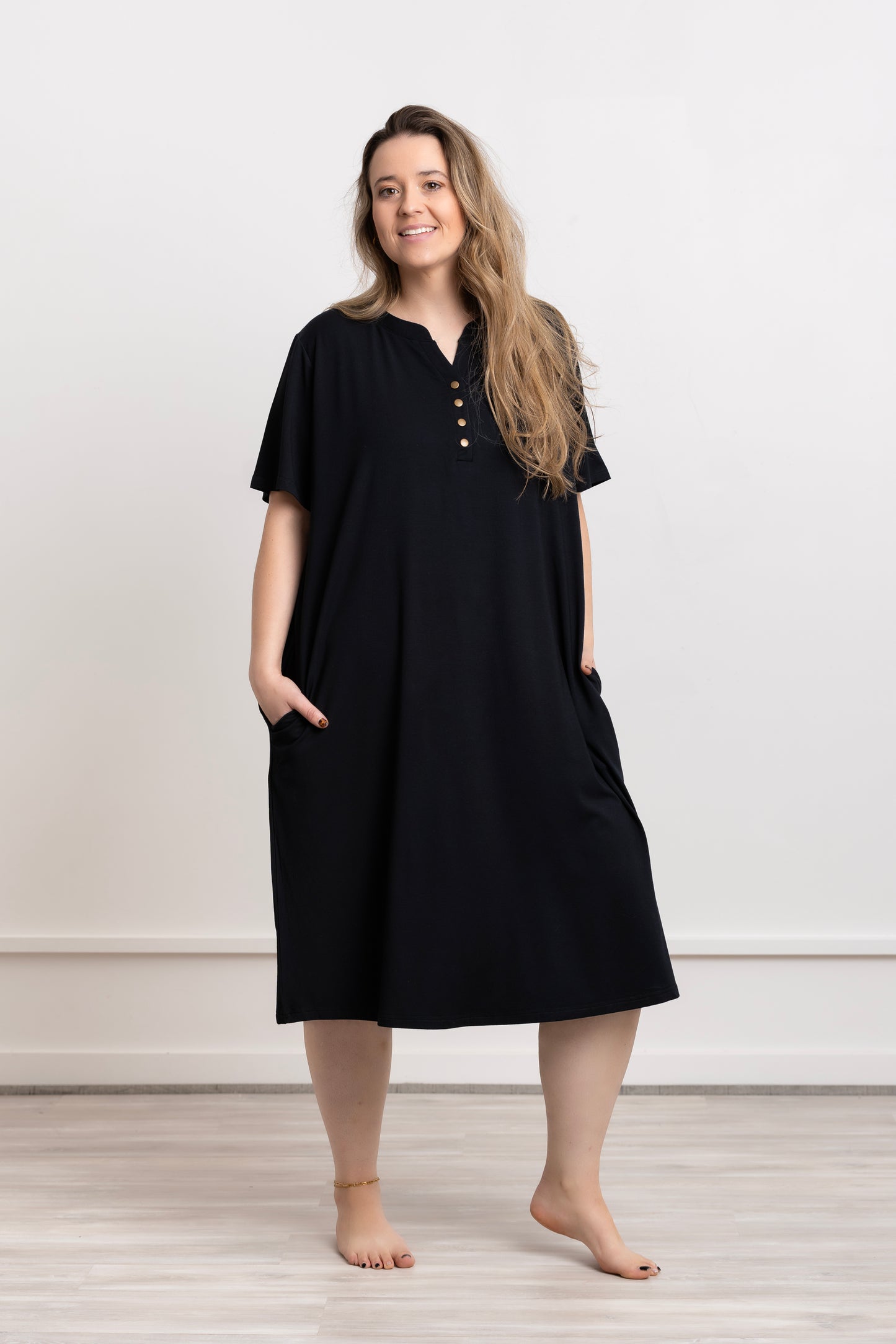 Cooling Modal Nightgown Dress in black, featuring a button-up design and pockets for added comfort.