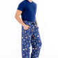 Man wearing blue pajama pants with animal pattern on a white background