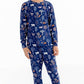 Front view of child wearing kids pajama set in Woodland Night forest print