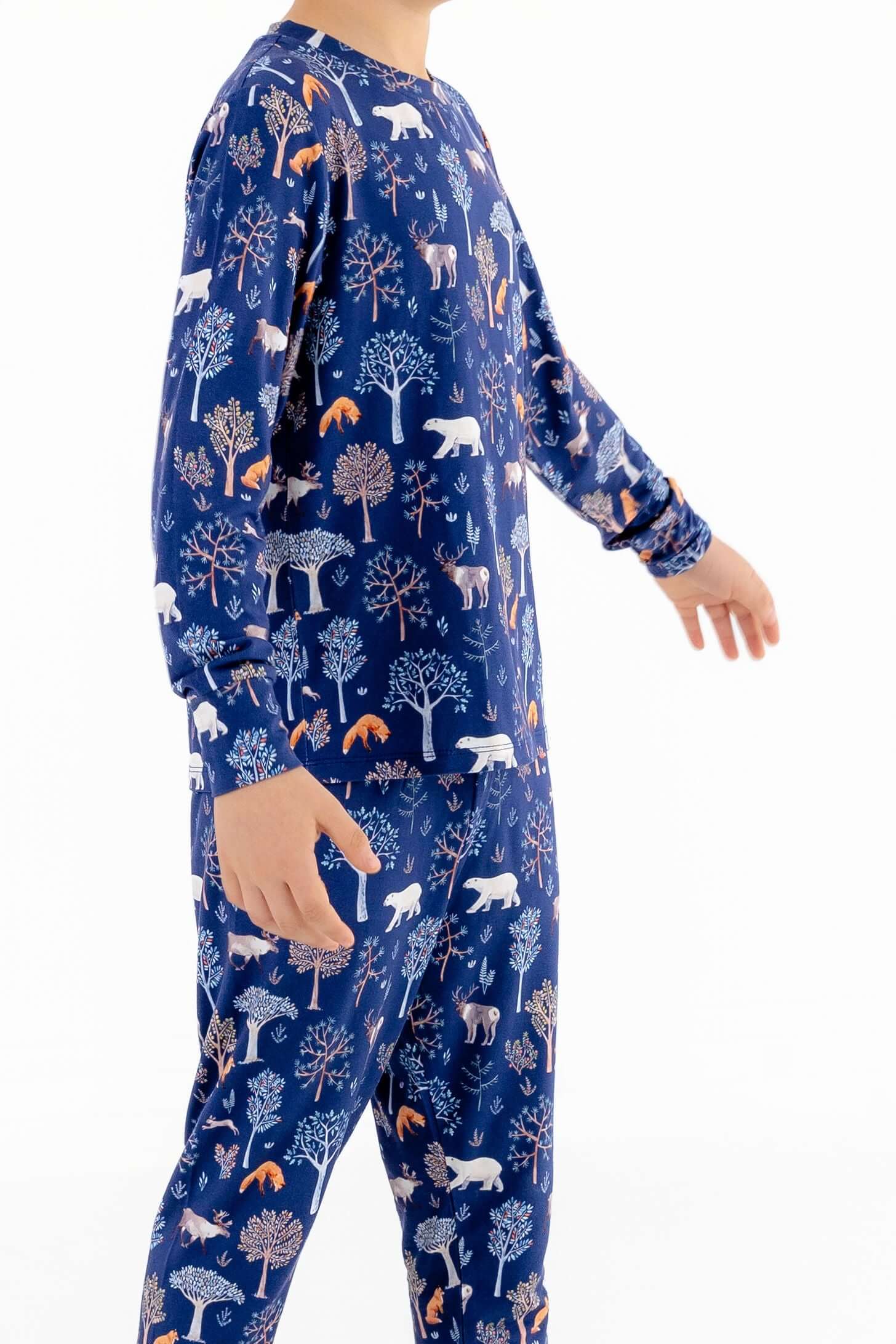 Side view of child modeling soft modal kids pajama set in Woodland Night