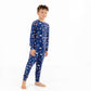 Front view of child wearing kids pajama set in Woodland Night forest print