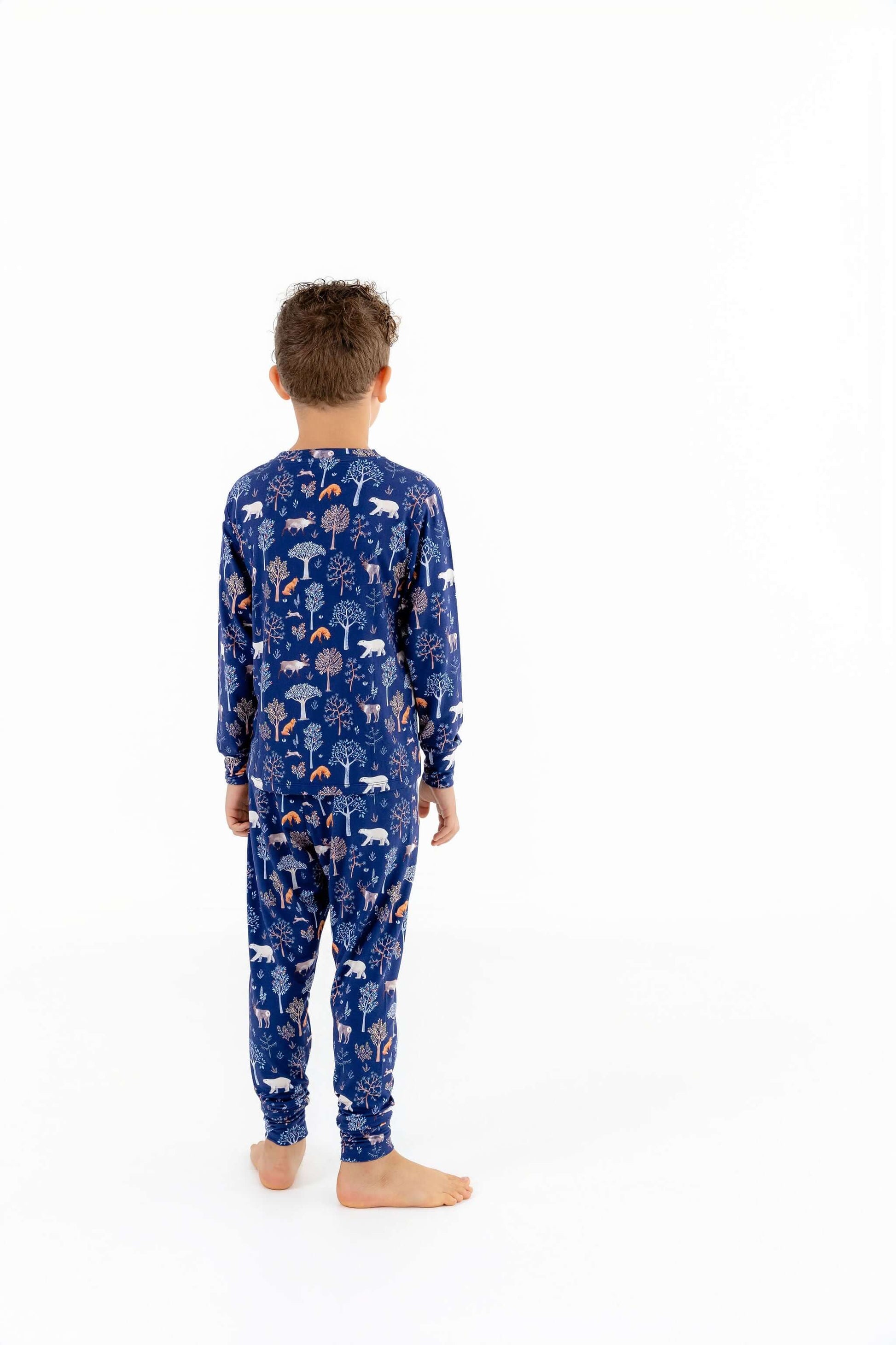 Back view of Woodland Night kids pajamas with cuffed pants and long sleeves