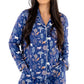 Woman wearing Women TENCEL Modal pajama set in Woodland Midnight print with long sleeves, showcasing comfort and sustainability.