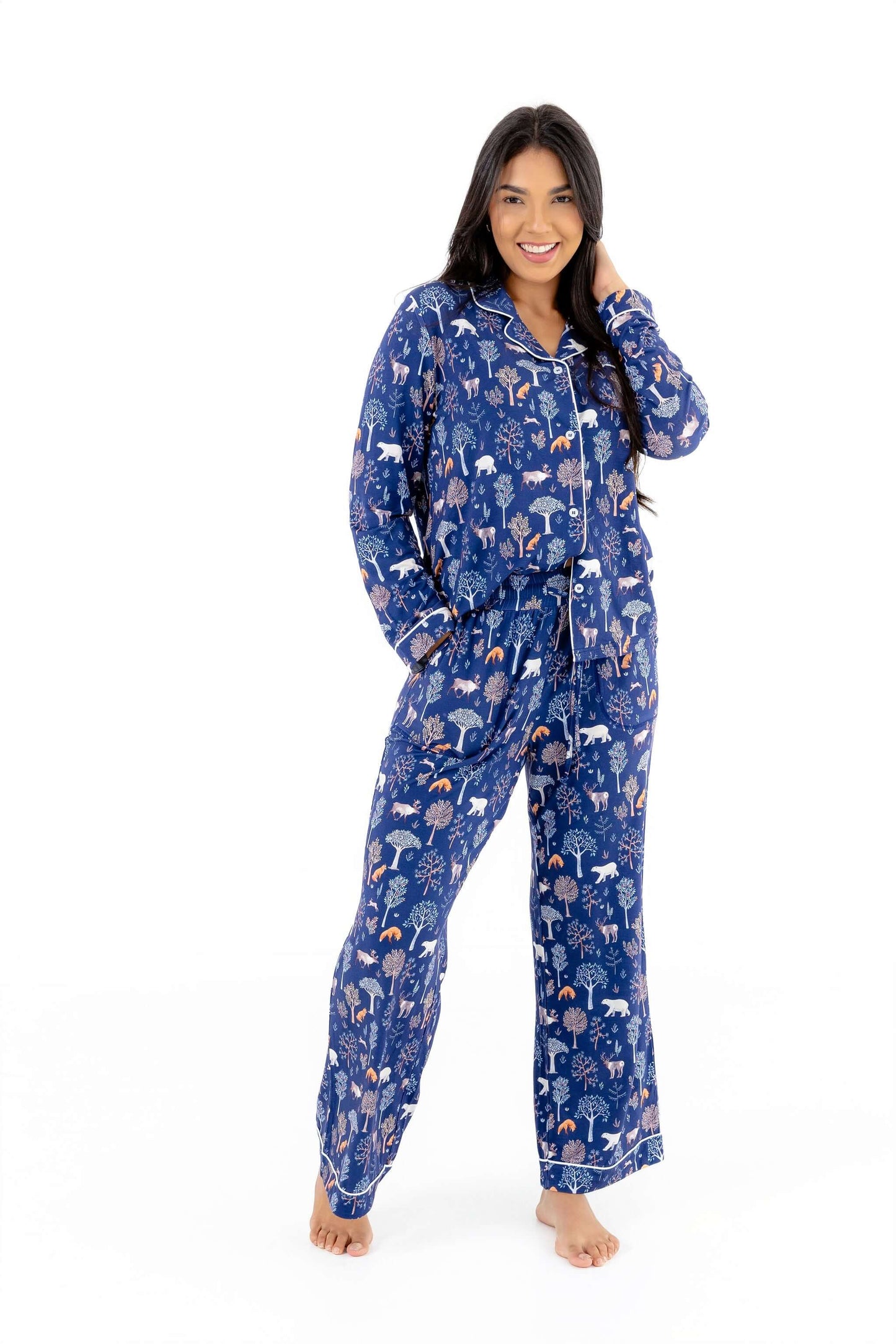 Woman wearing Women TENCEL Modal pajama set in woodland print, showcasing soft, breathable, sustainable nightwear in midnight blue color.