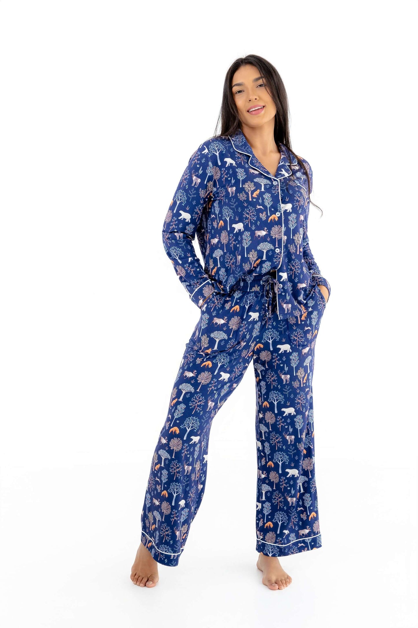 Woman wearing Women TENCEL Modal pajama set in Woodland Midnight print, displaying comfort and style.