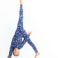Girl doing a cartwheel in kids pajama set – Woodland Night print shows soft, stretchy fit and freedom to move
